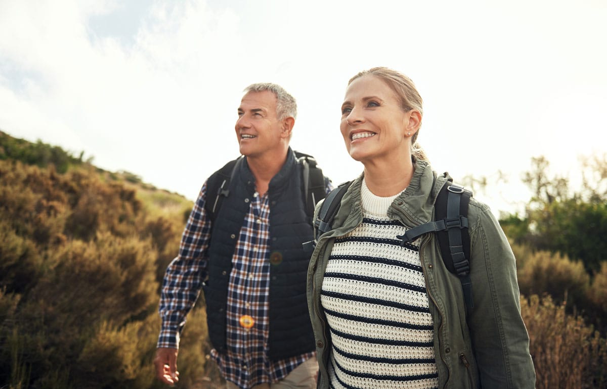 middle-aged couple taking a hike